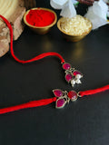 Red Stone Pearl Rakhi Duo in Silver Polish | AMOLA