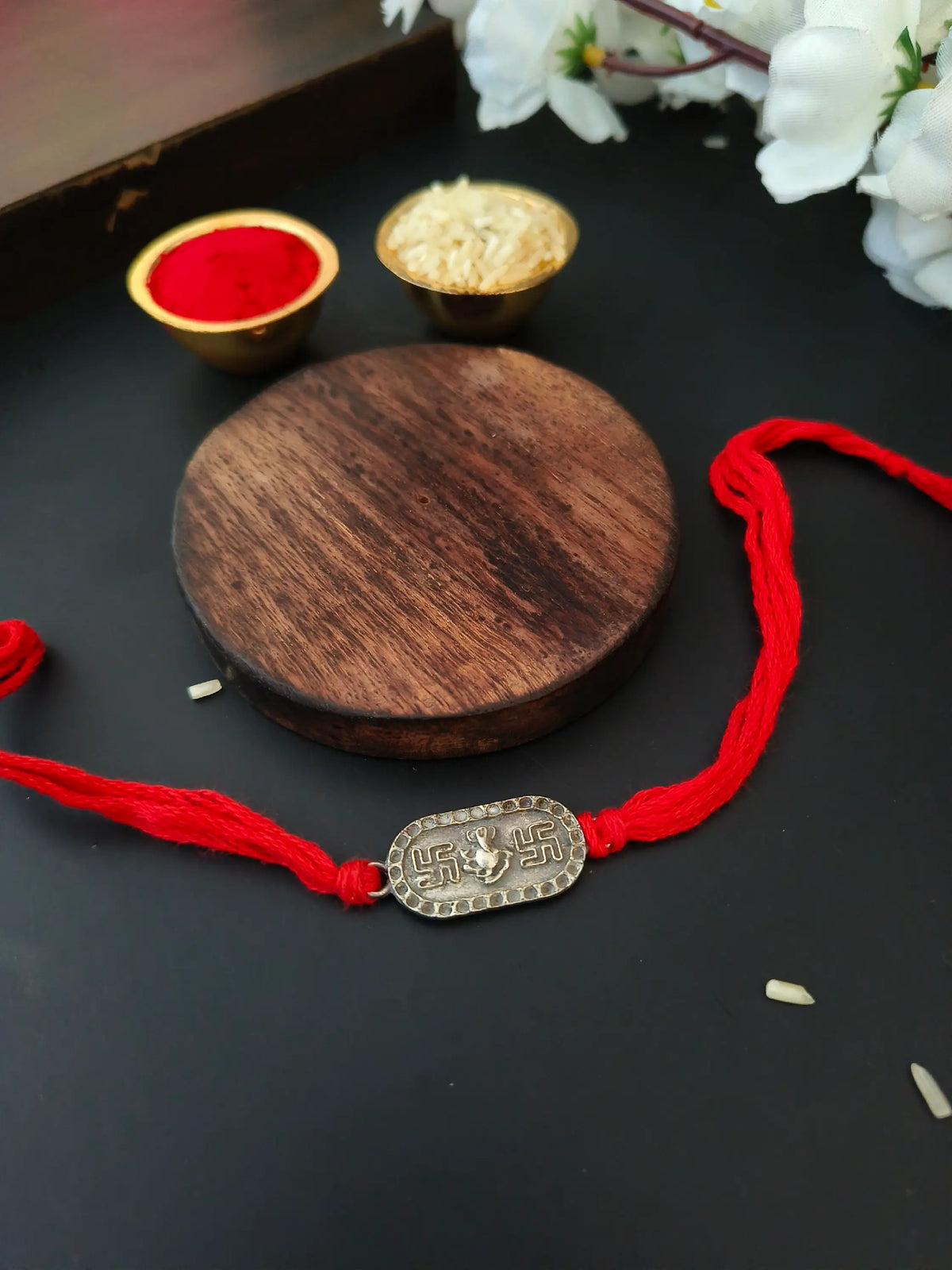 Silver Swastik Ganesha Blessings Rakhi | AMOLA