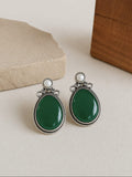 Elegant Oxidised Oval Monalisa Stud Earrings with Silver Polish | AMOLA